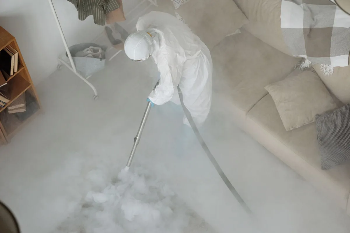Biohazard cleanup technician in protective equipment, Salida, CO